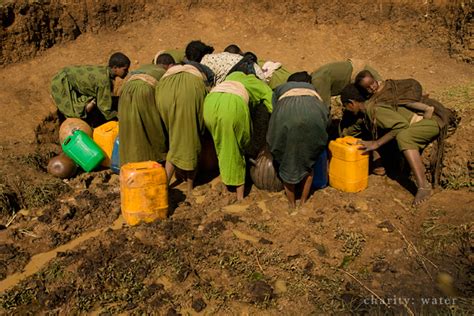 cleaning mud Ethiopia|Gasi Spring, Ethiopia .